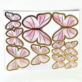 Set of 12 pink paper butterfly cake toppers with gold foil edges on white background - Pink Gold-Edged Butterfly Material Kit