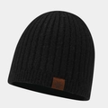 Detail of black ribbed knit beanie featuring a brown leather patch with a snowflake logo - One Size / Black