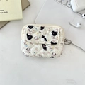 Quilted cream card wallet with black cat and dog prints on a modern desk setup - Black Cat & Dog
