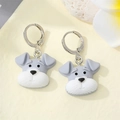 Detail view of Schnauzer dog acrylic drop earrings with hooks on a floral background - Puppy Head