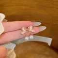Elegant champagne gold butterfly earrings with faux pearls and sparkling rhinestones - Rose Gold + White Pearl Butterfly Earring Post (a2150)