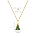 Golden necklace with green enamel Christmas tree pendant and star detail on white base - Star Christmas Tree