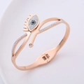 Bracciale a molla occhio di Allah oro rosa con cristalli bianchi e blu scintillanti - Oro rosa
