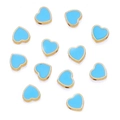 Macro shot of 8mm light blue enamel heart beads with gold-plated edges for DIY jewelry - Blue