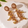Detailed shot of golden Chinese New Year earrings with sparkling yellow rhinestones - Gold Rhinestone Fa Character Dangle Earrings (Silver Pin)