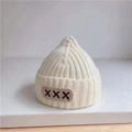 Cream knit baby beanie with ribbed texture and brown 'XXX' letter patch detail - Children X-Label Hat - White