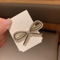 Elegant black bow hair clip with sparkling rhinestone border on display card - Crystal Bowtie