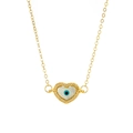 Macro detail of gold heart pendant with shell evil eye and sparkling zircon stones - Heart Evil Eye Mother of Pearl