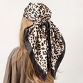 Beige leopard print satin headscarf with black borders worn by model on white background - 90*90cm / Leopard Print