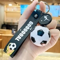 Fußball Schlüsselanhänger in Schwarz-Weiß mit Silikonband und silbernem Metallring - Weiß