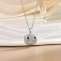 Close-up of owl pendant with sparkling crystals and black stone eyes on silver chain - Silver Owl/Black Eyes Full Pave