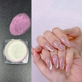 Macro shot of iridescent aurora nail powder showing white powder and pink purple effect - Aurora Rose