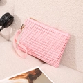 Pink woven straw beach wristlet bag with gold zipper and intricate crochet texture - Pink
