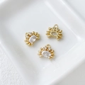 Detailed view of three 14k gold-plated crab pendants with oval crystal inlays on ceramic - 8# Crab