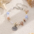 Dettaglio di un braccialetto da spiaggia con ciondoli a stella marina e perline blu - Stile Oceano Blu Cielo Argento Antico (08 Argento Antico Blu Cielo 3189)