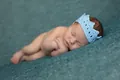 Macro shot of light blue hand-knitted baby crown headband for newborn photo shoots - Crown 6 / Light Blue