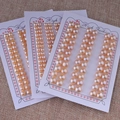 Champagne freshwater pearls on white display cards for jewelry making DIY projects - Pink 6A