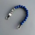 Detail of blue and checkerboard wooden beads on mobile phone strap with metal clasp - Phone Chain #5 (Blue & White Checkerboard)
