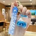 Blue sailing boat oil liquid keychain with silicone Bubble strap and golden metal ring - Sapphire Blue Sailboat - Milk Carton
