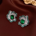 Macro detail of silver flower earrings with emerald green gems and white rhinestones - 32# Silver Emerald Vintage Court (925 Sterling Silver Earring Post)