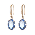 Elegant gold drop earrings featuring oval blue crystal and white cubic zirconia accents - White + Blue