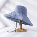 Detail of wide-brim sun hat in dusty blue with adjustable windproof strap and wavy edge - M(56-58cm) / Upgraded Sky Blue (21I021)