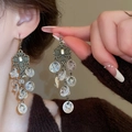Bohemian silver drop earrings with floral engravings and pearlescent shell tassels - Silver Copper Vintage Style