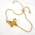 Adjustable golden box chain bracelet featuring a sparkling yellow crystal butterfly charm - Iridescent Yellow