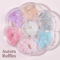 Detailed top view of aurora colorful skirt-shaped nail charms in a flower storage box - MH-12 Aurora Skirt 7 Colors