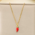 Detailed close-up of a tiny red chili pepper pendant on a fine gold chain necklace - Bright Red Chili Style (KN292083-Z)