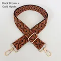 Close-up of thick geometric woven bag strap in black and brown with golden metal hooks - Black & Brown + Gold Hardware