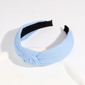 Light blue knotted headband featuring textured ribbed fabric and non-slip interior - Light Blue