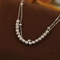 Double-layered S925 silver bracelet featuring diamond-cut beads and a polished finish - White Gold