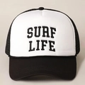 Detailed macro view of the SURF LIFE embroidery on the black and white trucker hat - One Size / Black & White