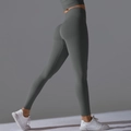 Detailed close-up of charcoal grey seamless high waist yoga leggings with scrunch butt lifting effect - Dark Gray