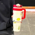 White large capacity water tumbler with fruit pattern and bright red handle and lid - Red & White New (Tropical Fruit)