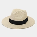 Macro view of woven straw texture and black band detail on a beige Panama sun hat - One Size / Beige