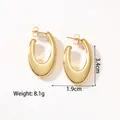 Detailed macro view of 18k gold-plated hollow U-shape hoop earrings in polished steel - KC-E15 Gold Oval