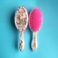 Spazzola trasparente per bambini con dinosauro, paillettes colorate e setole rosa - Modello in Schiuma di Dinosauro con Aghi Rosa