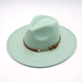 Close-up of mint green fedora hat featuring a brown leather strap and gold metal buckle - Mint Green (Heart Buckle)