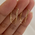 Detail of three-layer gold-plated snake chain tassel earrings held in hand - Triple Layer Snake Chain Fringe Style (Silver Pin-Gold)