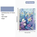A5 2026 floral weekly planner with purple blooms, gold twin-wire binding and elastic band - Romantic Blue (2026)