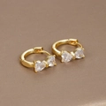 Macro shot of 18K gold plated bow earrings with sparkling pave-set cubic zirconia - Gold-White