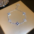 Adjustable silver bracelet with clover charms and black zircon inlay on a golden box - Bracelet-Silver-Black