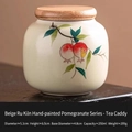 Mini beige Ru kiln ceramic tea canister with hand-painted pomegranate and wooden lid - Hand Painted Ru Kiln - Pomegranate