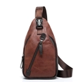 Detail view of brown PU leather chest bag with metal zipper and nylon strap - Dark Brown