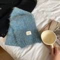 Soft teal wool blend scarf with ggg woven label on white bedding background - 3g Series / Light Blue