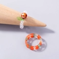 Handmade strawberry beaded ring and resin fruit band on a wooden display stand - Strawberry Acrylic Ring (SE1078)