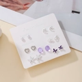 Set of seven pairs of silver and purple stud earrings on a weekly fashion display card - Purple Butterfly Star Sea Style (E1993-1)