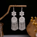 Ethnic bohemian silver tassel earrings with floral accents and hook style design - Double-layer Flower Cylindrical Tassel Style (E5577)